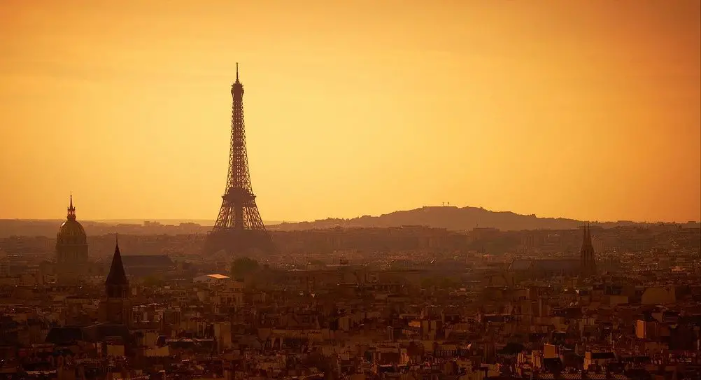 Songs about Paris France - The Eiffel Tower dominates the heart of Paris at sunset